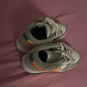 ' White and Gray Sneakers with Orange and Green Accents